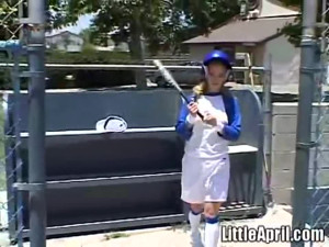 Little April rubs her pussy after baseball