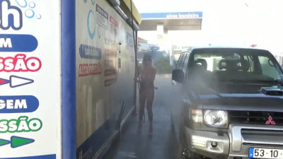 Naked blonde washed jeep at a public car wash