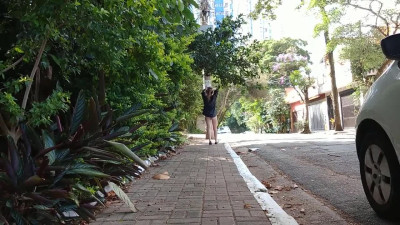 Nude exhibitionism on the street in broad daylight