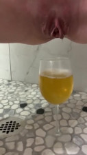 ASMR Sexy little pussy pissing into a wine glass.