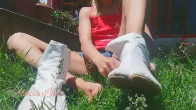 Girl Wearing her White Ninja Shoes in the Garden