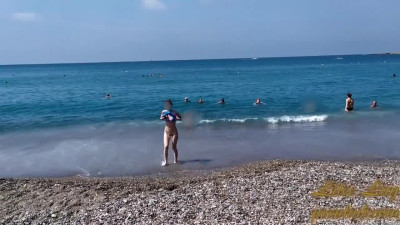 I am in a Transparent Mini Bikini on a Public Beach, I think the Witnesses liked It.