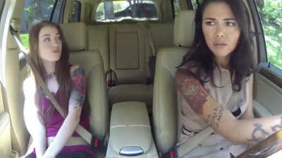 Dana Vespoli and gorgeous younger red haired girl inside a car in lesbian scenes