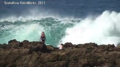 Big Wave Slams Couple Into Jagged Rocks