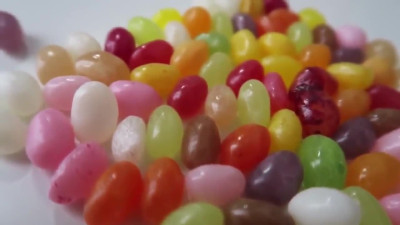 Sexy girl chews jelly beans! Close-up!