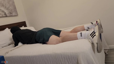 man humping bed in white socks