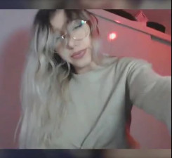 Petite Blonde with Glasses fingering her pussy