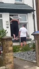 British women tits pop out while trying to climb into her house through her window