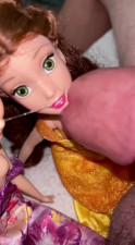 Disney’s Belle and Elsa Barbie doll getting facial cumshots.