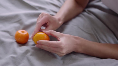 Hailey Sanders and Sybil A Kailena on a grey and white bed in several lesbian scenes