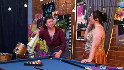 Charlie Chaos and Max Peach on a blue billiards table in a GirlsOutWest lesbian scene