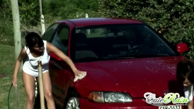 Cute rain gets wet washing car with lesbo