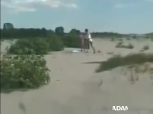 Two lesbians finger and lick each other on the beach